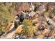 Stunning aerial view of a stately brick home with mature trees and a circular driveway at 3832 Wesley Chapel Rd, Marietta, GA 30062