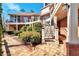Stone patio with steps leading to manicured grounds with fountain and multiple decks at 3832 Wesley Chapel Rd, Marietta, GA 30062