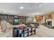 Finished basement featuring a cozy living area, fireplace, shelving, and ample space for entertainment at 3832 Wesley Chapel Rd, Marietta, GA 30062