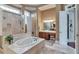 Bathroom with a soaking tub, a walk-in shower, and a double vanity at 3832 Wesley Chapel Rd, Marietta, GA 30062