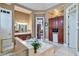 A spacious bathroom featuring a soaking tub, a double vanity, and a built-in cabinet at 3832 Wesley Chapel Rd, Marietta, GA 30062