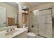 Clean bathroom featuring a glass-enclosed shower, vanity with ample space, and neutral tones at 3832 Wesley Chapel Rd, Marietta, GA 30062