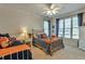 Inviting bedroom with two beds, large windows providing lots of natural light and bright, colorful decor at 3832 Wesley Chapel Rd, Marietta, GA 30062