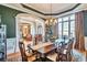 Elegant dining room featuring hardwood floors, wainscoting, and natural light, perfect for gatherings at 3832 Wesley Chapel Rd, Marietta, GA 30062