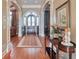 Grand foyer with hardwood floors, arched doorways, and elegant details creates a welcoming entrance at 3832 Wesley Chapel Rd, Marietta, GA 30062