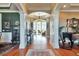 Spacious foyer with hardwood floors, white pillars, and a view into the naturally lit living space at 3832 Wesley Chapel Rd, Marietta, GA 30062