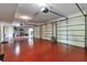 Spacious four car garage with red epoxy flooring and multiple garage door openers at 3832 Wesley Chapel Rd, Marietta, GA 30062