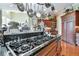 Open kitchen featuring custom cabinetry, stainless steel appliances, and central island with breakfast bar seating at 3832 Wesley Chapel Rd, Marietta, GA 30062