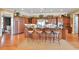 Gourmet kitchen with center island, bar stool seating, custom cabinetry, and professional stainless appliances at 3832 Wesley Chapel Rd, Marietta, GA 30062