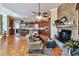 Spacious kitchen with a stone fireplace, central island and breakfast bar, and custom wood cabinetry at 3832 Wesley Chapel Rd, Marietta, GA 30062