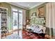 Light-filled living room with hardwood floors, a white sofa, and French doors leading outside at 3832 Wesley Chapel Rd, Marietta, GA 30062