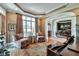 Cozy sitting area with hardwood floors, detailed trim, and large windows, adjacent to dining room at 3832 Wesley Chapel Rd, Marietta, GA 30062