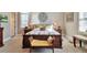 Cozy main bedroom with a decorative wrought iron accent above the upholstered-headboard bed at 3832 Wesley Chapel Rd, Marietta, GA 30062