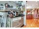 Walk-in pantry with shelving, stainless steel appliances, and access to the main kitchen in a luxury home at 3832 Wesley Chapel Rd, Marietta, GA 30062