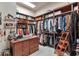 Spacious walk-in closet with custom wood shelving and ample storage for clothing and accessories at 3832 Wesley Chapel Rd, Marietta, GA 30062
