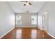 Large bedroom with neutral walls and two large windows at 4550 Cold Spring Ct, Cumming, GA 30041