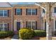 Charming brick townhome with manicured landscaping and classic architectural details at 4550 Cold Spring Ct, Cumming, GA 30041
