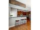 Well-equipped kitchen with breakfast bar, stainless steel appliances, and rich cabinetry at 4550 Cold Spring Ct, Cumming, GA 30041