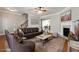 Comfortably staged living room with hardwood floors and ample natural light at 4550 Cold Spring Ct, Cumming, GA 30041