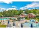 Resort-style pool area with ample seating and umbrella-shaded lounge chairs at 4550 Cold Spring Ct, Cumming, GA 30041