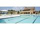 Large swimming pool with lane dividers and comfortable lounge chairs for relaxation at 4550 Cold Spring Ct, Cumming, GA 30041