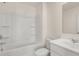 A clean bathroom featuring a shower-tub combination and vanity at 1069 Blue Juniper Cir, Loganville, GA 30052