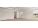 Bedroom featuring plush carpet, white walls, and a view from a sun-filled window at 1069 Blue Juniper Cir, Loganville, GA 30052