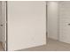 This bedroom features neutral carpeting, white walls, and a paneled white door at 1069 Blue Juniper Cir, Loganville, GA 30052