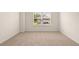 Empty bedroom with neutral carpet and a large window offering natural light at 1069 Blue Juniper Cir, Loganville, GA 30052