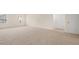 Spacious bedroom with neutral carpet, bright windows, and a double door closet at 1069 Blue Juniper Cir, Loganville, GA 30052