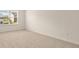 Bedroom with plush carpeting, a window, and neutral wall paint at 1069 Blue Juniper Cir, Loganville, GA 30052