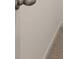 Close-up of a doorknob and doorway leading to a room with neutral carpet at 1069 Blue Juniper Cir, Loganville, GA 30052