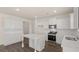 Contemporary kitchen with white cabinets, a kitchen island, and stainless appliances at 1069 Blue Juniper Cir, Loganville, GA 30052