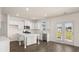 Modern kitchen featuring white cabinets, an island, and stainless steel appliances at 1069 Blue Juniper Cir, Loganville, GA 30052