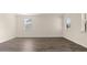 Open living room offers ample natural light from three large windows at 1069 Blue Juniper Cir, Loganville, GA 30052