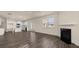 Open concept living room featuring a fireplace and view to kitchen and dining area at 1069 Blue Juniper Cir, Loganville, GA 30052
