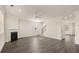 Spacious living room with fireplace, hardwood floors, and staircase at 1069 Blue Juniper Cir, Loganville, GA 30052