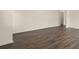 Spacious living room with modern hardwood flooring and neutral color palette at 1069 Blue Juniper Cir, Loganville, GA 30052