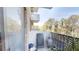 Relaxing outdoor balcony with a chair, decor, and views of the surrounding greenery at 300 Johnson Ferry Ne Rd # A403, Atlanta, GA 30328