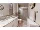 Bathroom with a sleek glass-enclosed shower and marble-topped vanity at 300 Johnson Ferry Ne Rd # A403, Atlanta, GA 30328