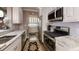 Kitchen with stainless steel appliances, custom cabinets, and granite counters at 300 Johnson Ferry Ne Rd # A403, Atlanta, GA 30328