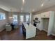 Open kitchen with an island, stainless steel appliances, and dining area at 507 Zeal Street # 334, Atlanta, GA 30315
