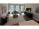 Bright living room with modern decor, large windows, and hardwood flooring at 507 Zeal Street # 334, Atlanta, GA 30315
