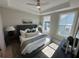 Bright main bedroom with tray ceilings, natural light, and carpet at 507 Zeal Street # 334, Atlanta, GA 30315