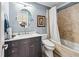 Bathroom with marble tile and a shower-tub combination at 8760 Colonial Pl, Duluth, GA 30097
