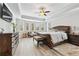 Bright bedroom with a large window, ceiling fan, and plenty of natural light at 8760 Colonial Pl, Duluth, GA 30097