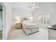 Bright bedroom with a ceiling fan, and neutral decor at 8760 Colonial Pl, Duluth, GA 30097
