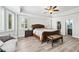 Bright bedroom with a large window, ceiling fan, and plenty of natural light at 8760 Colonial Pl, Duluth, GA 30097