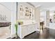 Charming Butlers pantry with white cabinets, marble countertop, and elegant glass door storage for glasses and bottles at 8760 Colonial Pl, Duluth, GA 30097