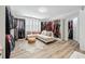 Spacious closet with custom built-ins, a seating area, and ample space for storage at 8760 Colonial Pl, Duluth, GA 30097